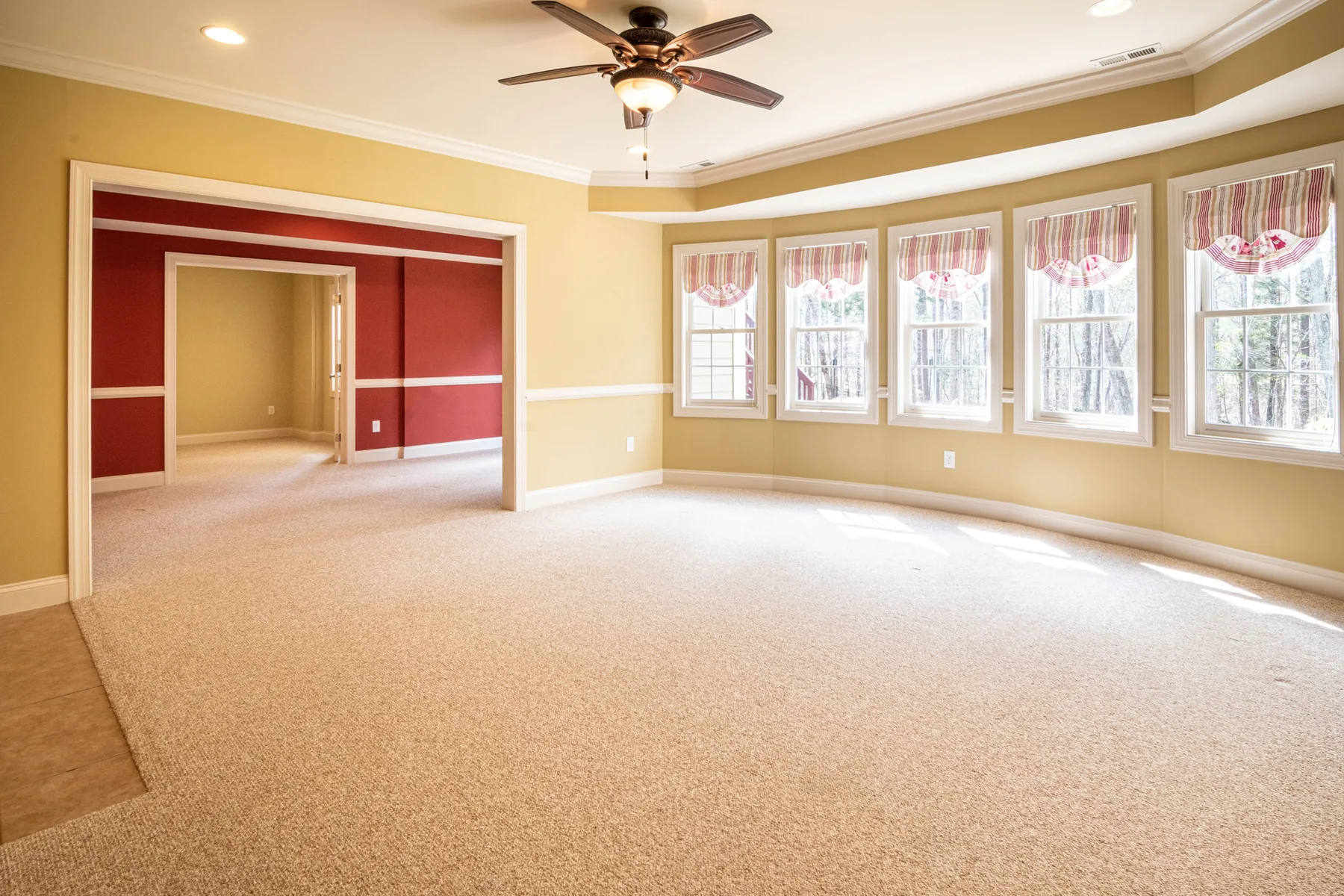 Modern ceiling fan installed in a bright living room